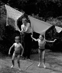 My Dad spraying his grandsons with the hose